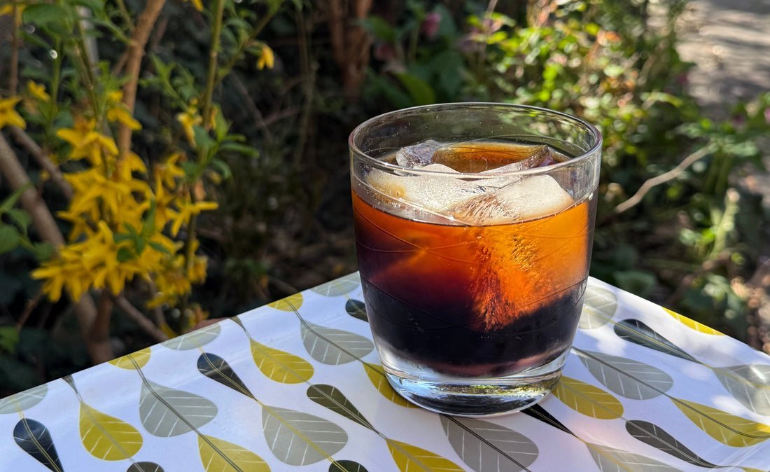 Boiling water is poured into cold brew concentrate to make hot coffee.