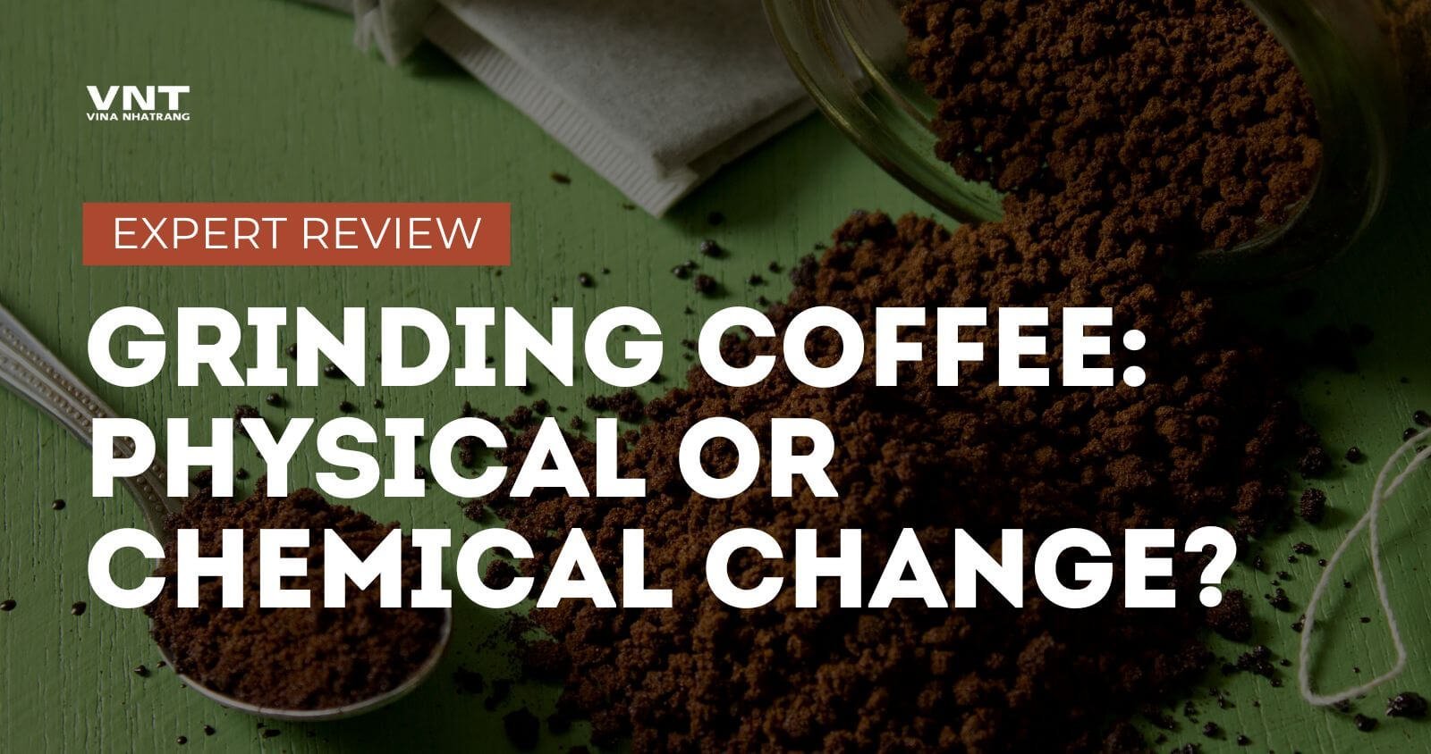 Manual coffee grinder filled with fresh grounds demonstrating the coffee grinding process.