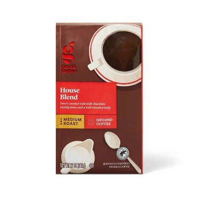 Measuring coffee grounds on a digital scale for the perfect brewing ratio.