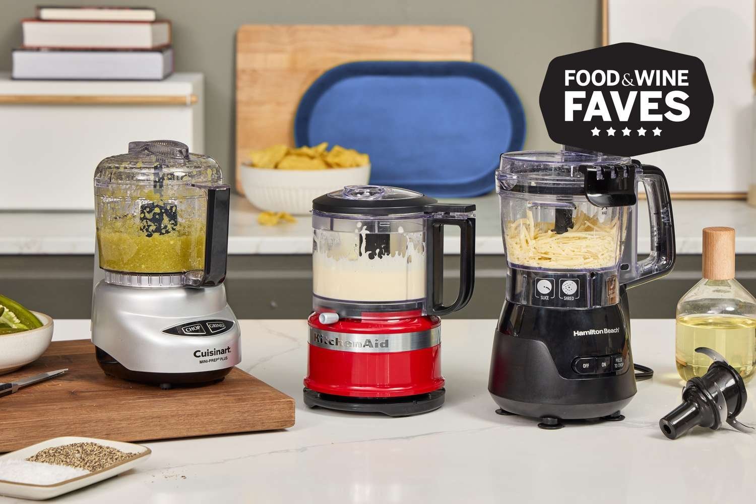 A modern blender filled with chopped onions on a bright kitchen countertop.
