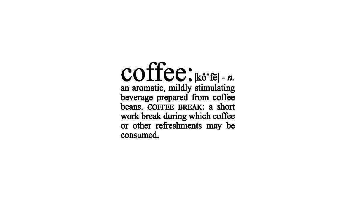 A steaming mug of coffee and roasted beans on a rustic wooden table.