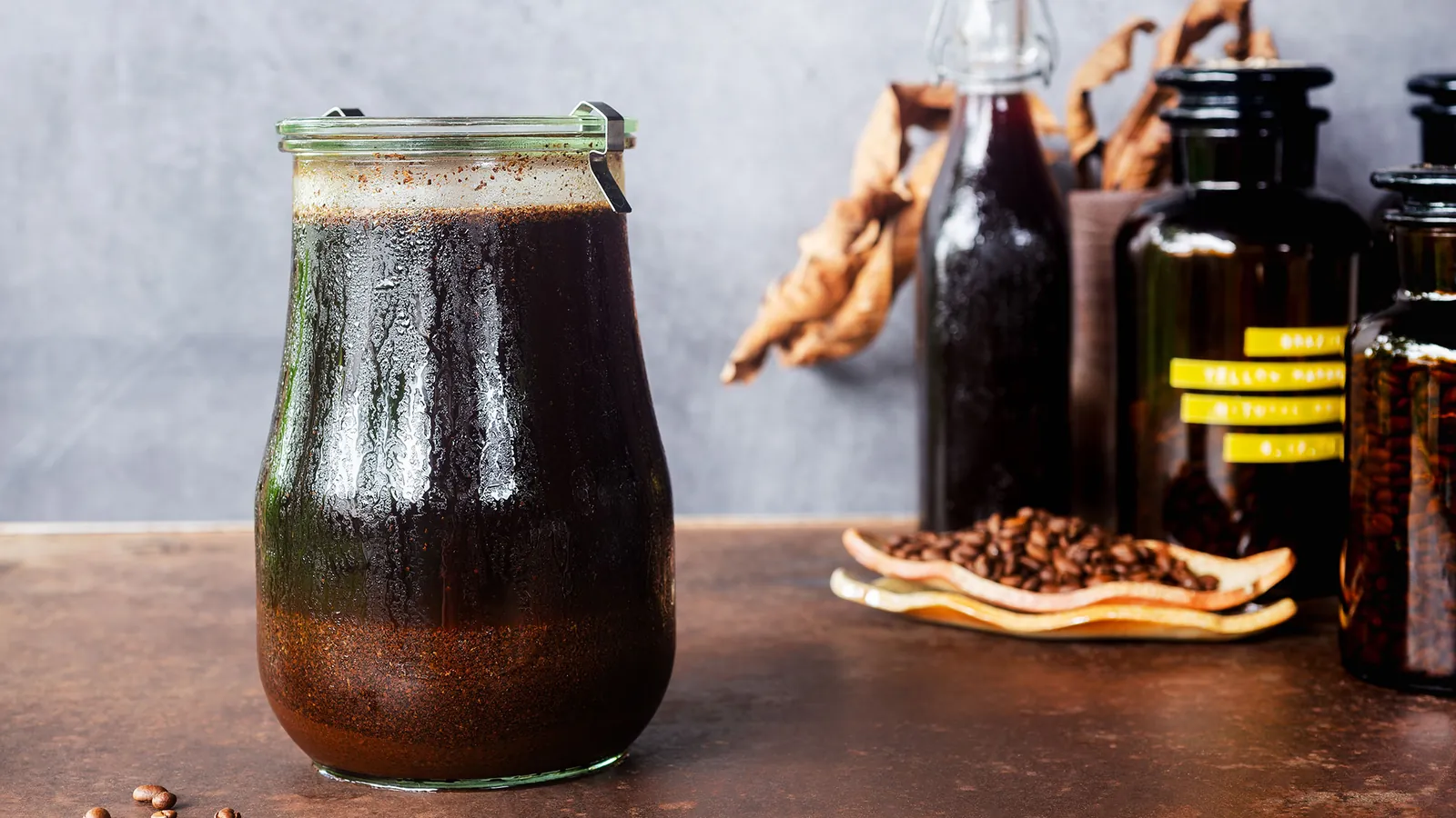 Cloudy over-steeped cold brew coffee sitting on a sunlit kitchen counter.