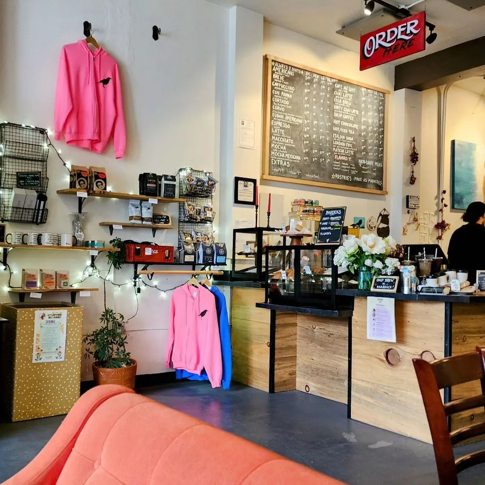 An empty, sunlit corner of a cafe during a quiet mid-morning period.