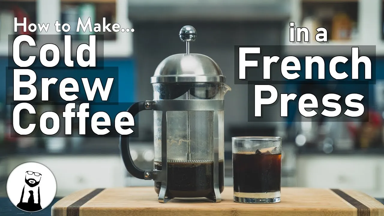 Two carafes of cold brew concentrate on marble countertop
